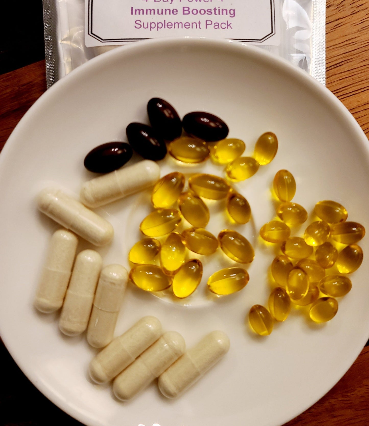 Picture of 4 Day Power 4 Immune Boosting Supplement Pack with a display of vitamins in a bowl on wooden countertop