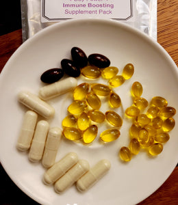 Picture of 4 Day Power 4 Immune Boosting Supplement Pack with a display of vitamins in a bowl on wooden countertop 