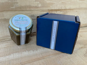 Specialty Gourmet Honey: Organic Moringa Infused Raw Honey - 12oz Jar Next To Blue Gift Box
